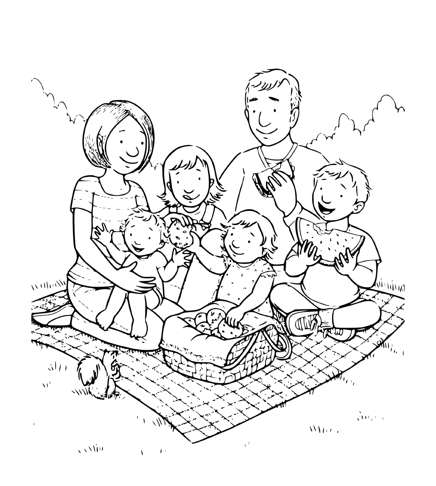  一个有四个孩子的家庭在草地毛毯上野餐 