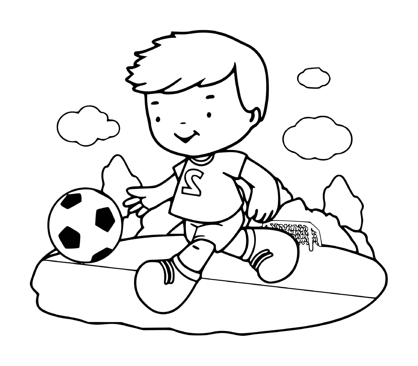  एक लड़का फुटबॉल जोश के साथ खेलता है 