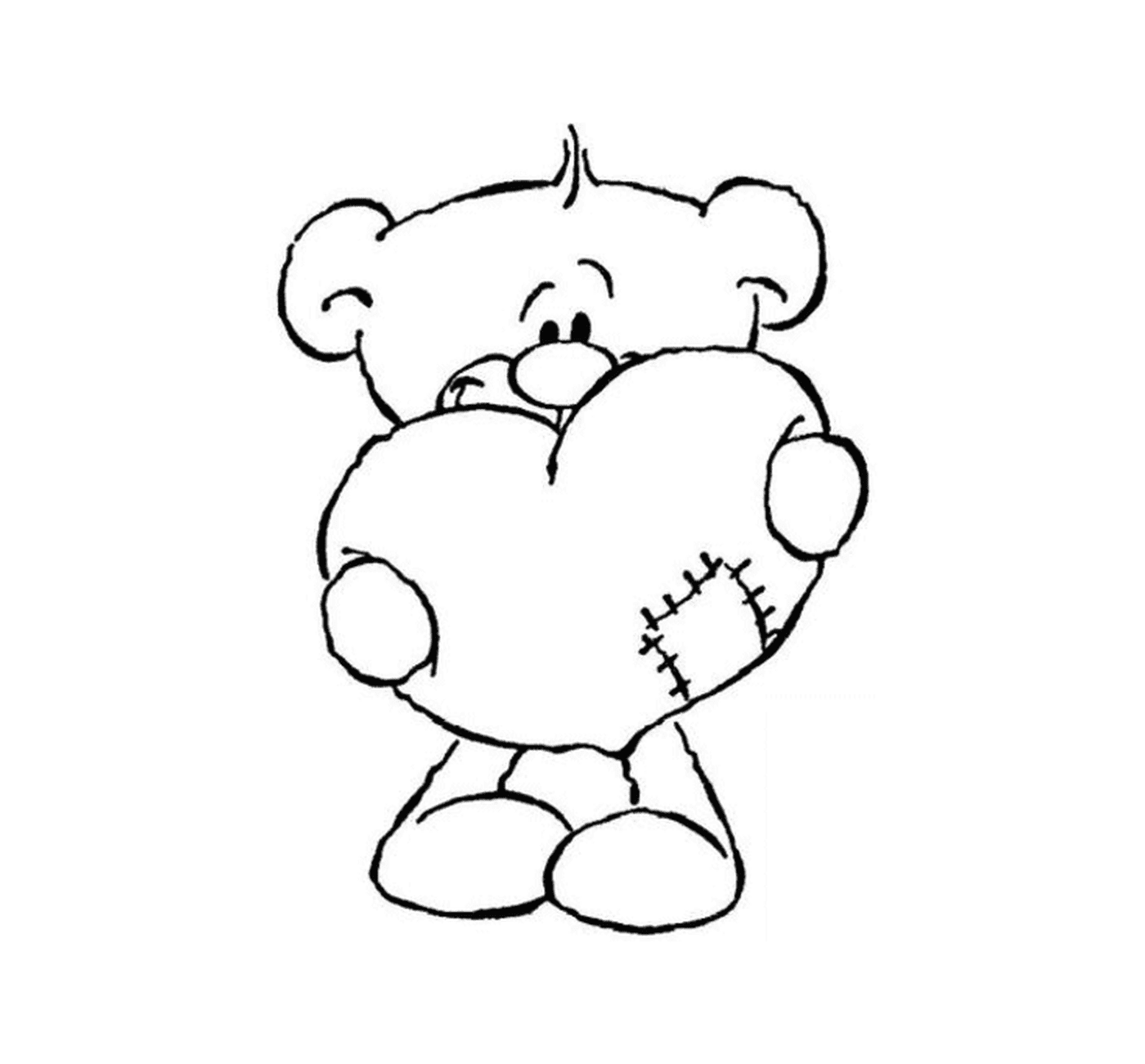  Um urso de pelúcia segurando um coração em suas mãos 