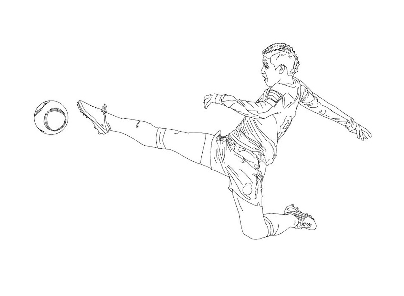 Um menino chutando em uma bola de futebol